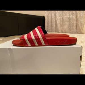 Red adidas slides